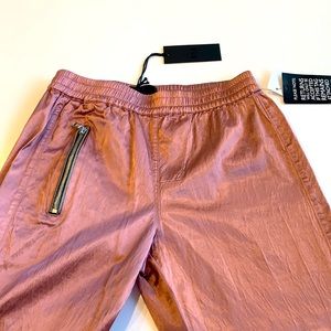 BNWT RTA pink satin joggers. Size medium.